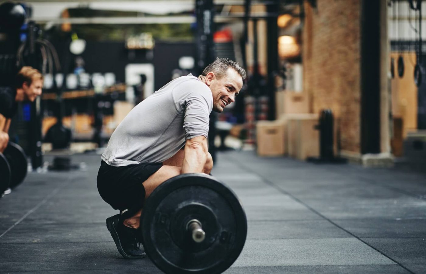 Man smiling while working out