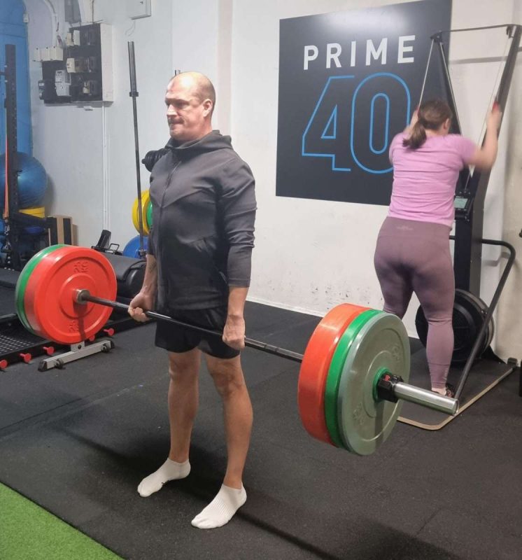 Man Doing Deadlift at Prime40 Gym